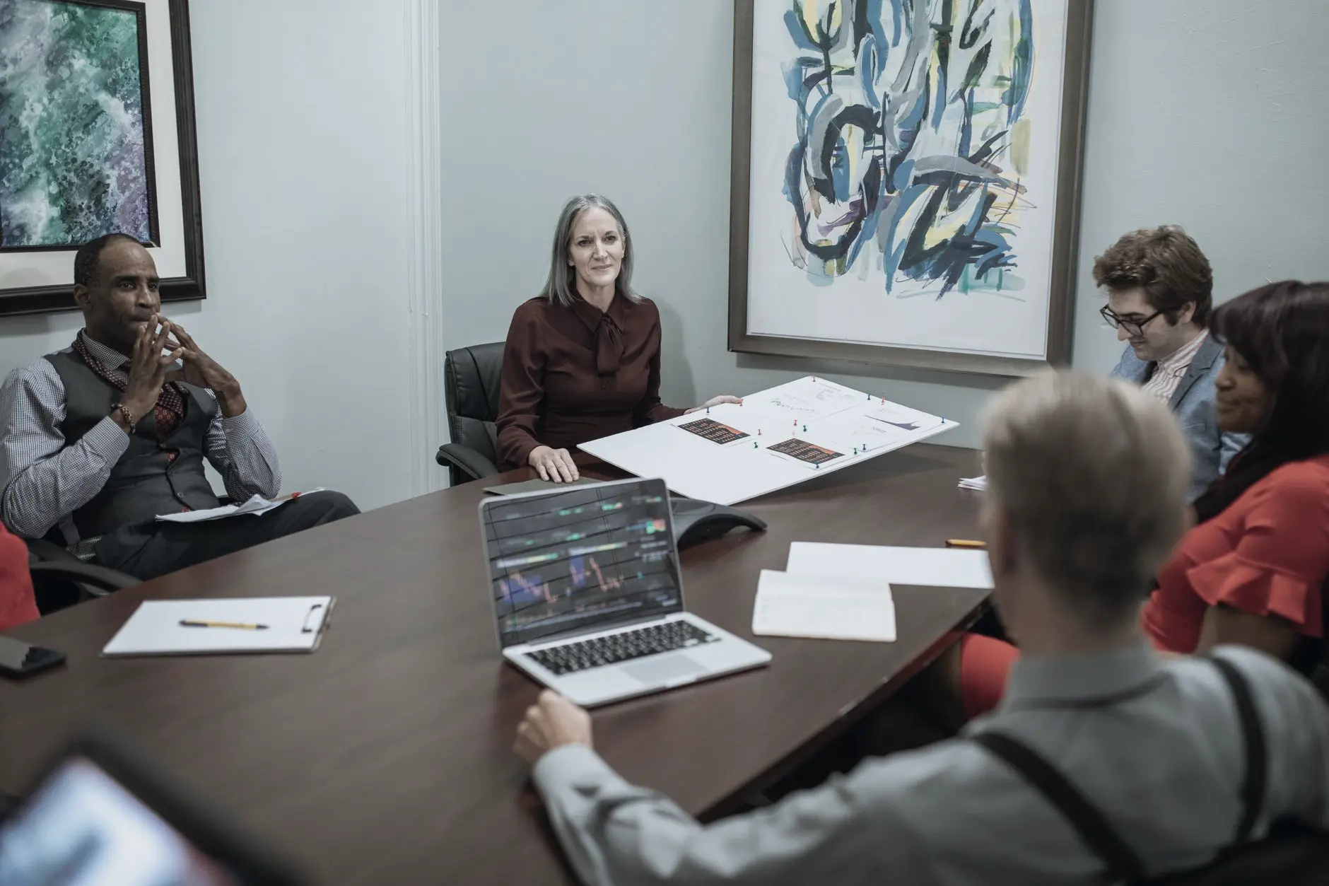 Group of professionals gathered around a conference table