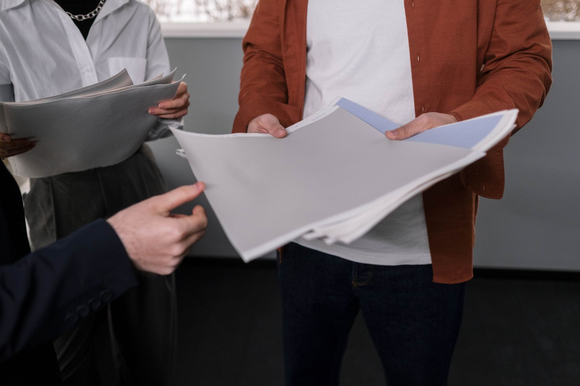Business professionals reviewing documents during a meeting